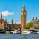 The iconic Big Ben and the Houses of Parliament alongside the Westminster Pier in London, UK.