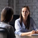 focused businesswoman in a conversation with a client at a business meeting