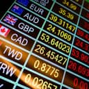 currency exchange rates shown on a digital LED display board