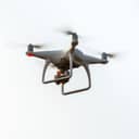 drone equipped with a digital camera flying in the sky