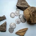 A collection of 15th-century silver coins known as 'dangi', originating from Eastern Europe and the Golden Horde.