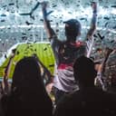 Visual representation of soccer fans celebrating a goal