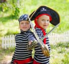 Two small boys playing pirates
