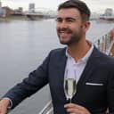 elegant upper-class man sipping champagne on a private yacht