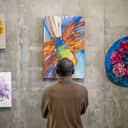 adult man observing art on wall artistic expression absract