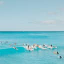 View of the ocean with people surfing
