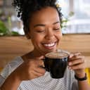 A young woman drinking coffee