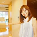 Woman welcoming guests into an apartment