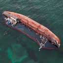 Overhead view of a capsized boat in water
