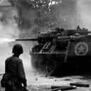 an American tank destroyer in action near Saint-Lo, France, during a combat operation in June 1944.