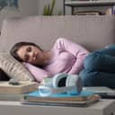 young woman taking a nap on a living room couch
