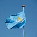 flag of the World Health Organization (WHO) against blue sky