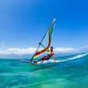Man windsurfing in the ocean