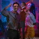 beautiful girl and boy dancing together, having fun on a costume college party