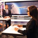 Two political candidates having a debate on a panel