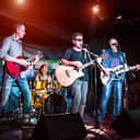 Band performing live music at night