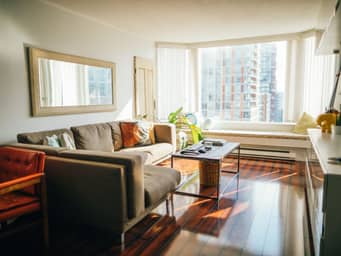 Spacious living room with lots of sunlight.