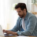 A young man working on his laptop