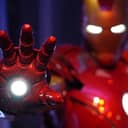 Iron Man statue with glowing eyes and a glowing hand