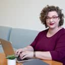Woman working on laptop indoors