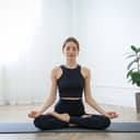 Woman practicing yoga indoors
