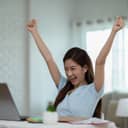 Woman raising her fists in celebratory fashion
