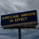 An electronic highway billboard with hurricane warning in effect message