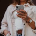 young woman holding a smartphone in her hand