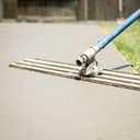 fresh concrete poured and reinforced with rebar for a patio construction