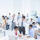 Businesspeople in the office during rush hour