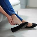 Uncomfortable Shoes Blister Pain. Woman With Sore Feet