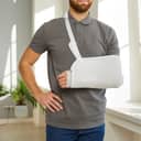 Man with his left arm in a medical sling