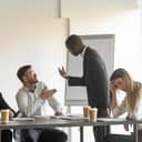 Two co-workers arguing during a meeting