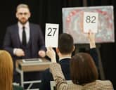 People bidding at an auction