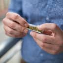 Man rolling up a joint