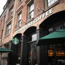 Starbucks Coffee building during daytime on a rainy day