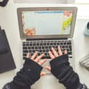 A person using their laptop