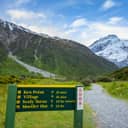 A sign directing to Kea Point, a hiking trail offering views of Muller Glacier and Muller Lakes in Mount Cook National Park, New Zealand.