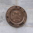 The seal of the United States Department of the Treasury is displayed within the Treasury building in Washington, DC.