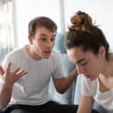 A young man arguing with his sad girlfriend.