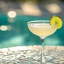 Margarita cocktail served by the poolside, with a slice of lime used as a decoration.