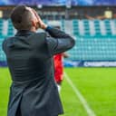 a disappointed coach on the soccer field