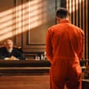 Court of Law and Justice Trial Proceedings: Law Offender in Orange Jumpsuit is Questioned and Giving Testimony to Judge, Jury. Criminal Denying Charges, Pleading, Inmate Denied Parole.
