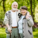 Elderly couple sharing a hug