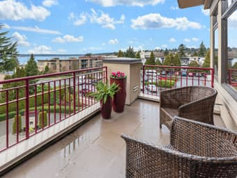 Spacious terrace overlooking a park.