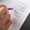 A closeup of a person editing a text