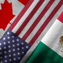 Close up of the flags of the North American Free Trade Agreement NAFTA members on textile texture. NAFTA is the world's largest trade bloc and member countries are Canada, United States and Mexico
