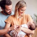 Family of three with a newborn baby