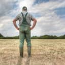 A farmer stands on his parched meadow and hopes for rain while the sun shines mercilessly on his farmland. Rising temperatures and too little rain the arable land in Germany is dry like never before.