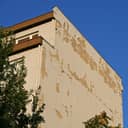 A facade flaking off of an old building